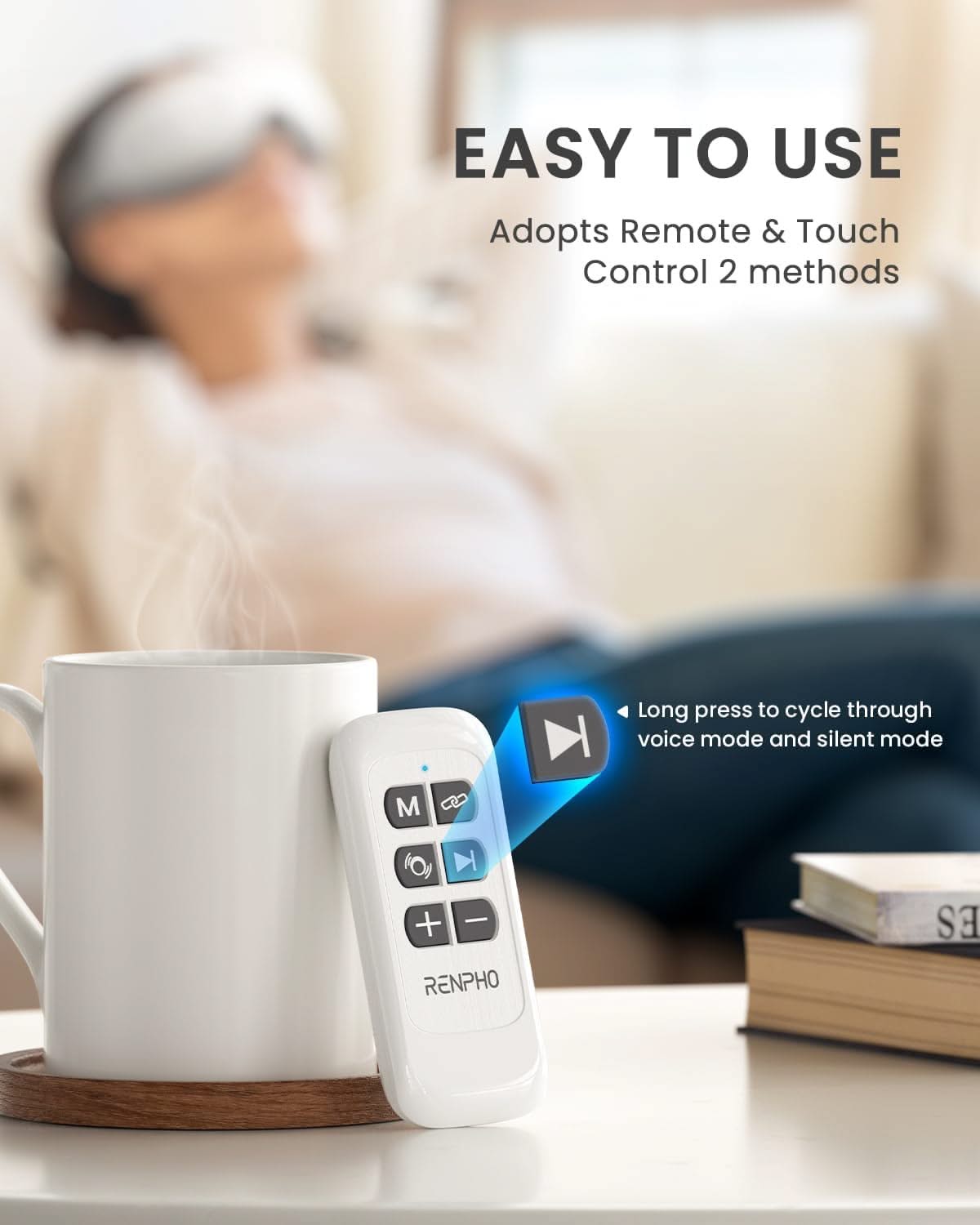A remote control and a steaming white mug are in the foreground on a table. In the background, a person is sitting on a sofa with an Eyeris 1 Eye Massager from RENPHO US on their head. Text reads: "EASY TO USE Adopts Remote & Touch Control 2 methods," highlighting the Bluetooth feature and instructions for switching modes, perfect for relieving eye strain.