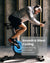 A man in a hoodie, shorts, and headphones rides the Renpho AI Smart Bike S with a blue-lit flywheel in a modern, dimly lit room. Text overlay reads: "Smooth & Silent Cycling - Magnetic Resistance, 13.2lb Flywheel, Noise Level ≤60dB.