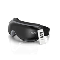 A black RENPHO US Eyeris 1 Eye Massager is pictured on a white background. The device has a sleek, curved design and features an adjustable strap. Equipped with Bluetooth for added convenience, it also includes a white remote control with six black buttons embossed with the RENPHO US logo.