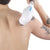 A man with a tattoo on his back receiving a tattoo removal treatment using the Renpho Handheld Massager.